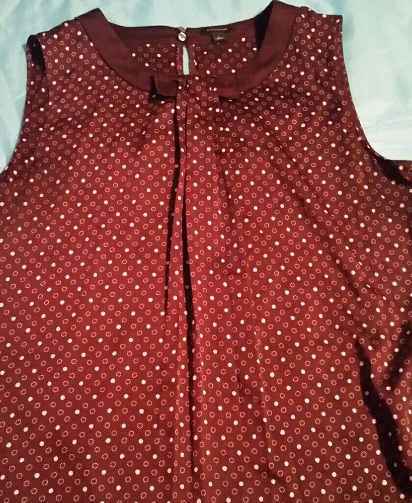 Purple sleeveless polka dot pattern top with bow